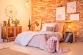 Warm bedroom with brick wall