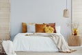 Warm blanket on white duvet in cozy bedroom interior Royalty Free Stock Photo