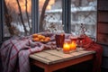 warm blankets and mulled wine on a wooden table outdoors