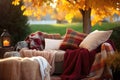 warm blankets and pillows assembled for cozy outdoor seating