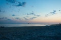 Warm blue sunset on the shore of the ocean, the sea, at sunset on a summer