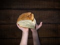 Warm bread in the hands of a child Royalty Free Stock Photo