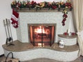 Warm, bright, cozy fire burning fireplace in the home Royalty Free Stock Photo