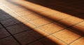 Warm brown ceramic tiles arranged in a grid pattern cover the floor. Sunlight Royalty Free Stock Photo
