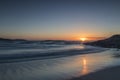 Warm, calm and beautiful sunset on the virgin beach of Barra, Ponteceso. The waves move smoothly Royalty Free Stock Photo