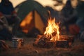 Warm campfire glow creates inviting atmosphere for cozy evening camping