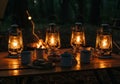 Warm Campfire Glow Illuminates Metal Lanterns and Rustic Table Royalty Free Stock Photo