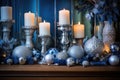 warm candles aglow amid blue and silver christmas decor