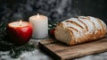 Warm Candles and Fresh Bread: A Cozy Rustic Kitchen Table Setting for the Holidays and Comfort Royalty Free Stock Photo