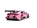 Warm candy pink modern super sports car - rear view