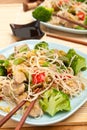 Warm Chinese salad with rice noodles