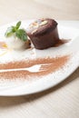 Warm chocolate cake Fondant with ice-cream ball, almond, mint, c