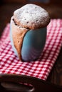 Warm chocolate cake in a mug sprinkled with icing sugar