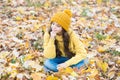 Warm clothes fashion. seasonal weather. childhood happiness. beauty of fall nature. happy kid wear knitted sweater and Royalty Free Stock Photo