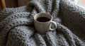 Warm Coffee in Grey Mug on Cozy Blanket Royalty Free Stock Photo