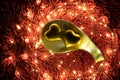 A warm color light garland surrounding two hearts inside plate. valentine`s day