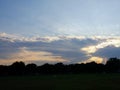 Colors of sunset above the silhouette of trees at the Washington, D.C. Mall