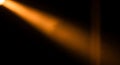 A warm, concentrated beam of light pierces through a dark environment, casting Royalty Free Stock Photo