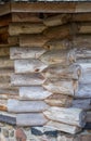 Warm corner of a log wooden blockhouse, close-up. Wooden house construction, architecture Royalty Free Stock Photo