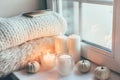 Hygge scene with sweater and candles Royalty Free Stock Photo