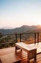 Warm cozy balcony with mountain view in morning or evening, Log