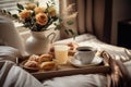 warm cozy bedroom interior with cup of coffee and sweets on tray