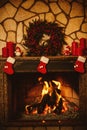 Warm cozy fireplace decorated for Christmas with real wood burni