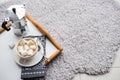 Warm cozy home. Tray and cup of coffee with marshmallows Royalty Free Stock Photo