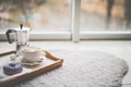 Warm cozy home. Tray and cup of coffee with marshmallows