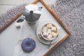 Warm cozy home. Tray and cup of coffee with marshmallows Royalty Free Stock Photo