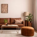 Warm and cozy interior of living room space with brown sofa, pouf, beige carpet, lamp, mock up poster frame, decoration, plant and