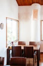 Warm cozy Japanese restaurant with wooden furniture white wall a Royalty Free Stock Photo