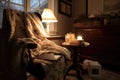 warm and cozy reading nook, with blanket and cup of tea, for a quiet evening Royalty Free Stock Photo