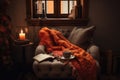 warm and cozy reading nook, with blanket and cup of tea, for a quiet evening Royalty Free Stock Photo