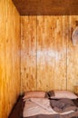 Warm cozy wooden wall bedroom with simple futon on the floor, Lo Royalty Free Stock Photo