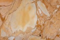Warm creamy colored orange chunky Italian marble with in an old building in Italy Europe with veining