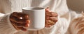 The warm cup of coffee held in cozy hands during a tranquil moment..AI generated image Royalty Free Stock Photo