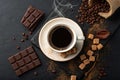 A Cup of coffee with bitter chocolate and dark brown sugar. On black rustic background Royalty Free Stock Photo