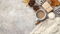A warm cup of coffee sits beside a wrapped gift and an open book on a textured fabric surface, creating a serene Royalty Free Stock Photo