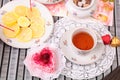 Warm cup of tea, heart shaped cake and sweets Royalty Free Stock Photo