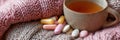 Warm Cup of Tea With Vitamins Surrounded by Cozy Knitted Wool Textures in a Serene Indoor Setting Royalty Free Stock Photo