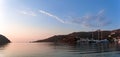 Warm dawn colors over the harbor of Patmos island, Dodecanese, Greece Royalty Free Stock Photo