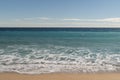 Warm day on a Cannes beach with azure waves of mediterranean sea