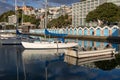 Warm Day At Marina, Blue Boat Sheds In Background