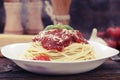 Warm, delicious spaghetti with sauce and basil.