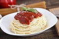 Warm, delicious spaghetti with sauce and basil