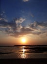 Warm dramatic sunset beach during low tide Royalty Free Stock Photo