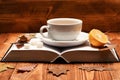 Warm drink and home relax concept. Tea cup on book Royalty Free Stock Photo