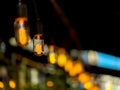 Warm Edison bulbs hanging string lights create cozy night scene for intimate gatherings Royalty Free Stock Photo