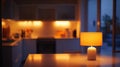 Warm Evening Glow: A Table Lamp Illuminates a Modern Kitchen Royalty Free Stock Photo